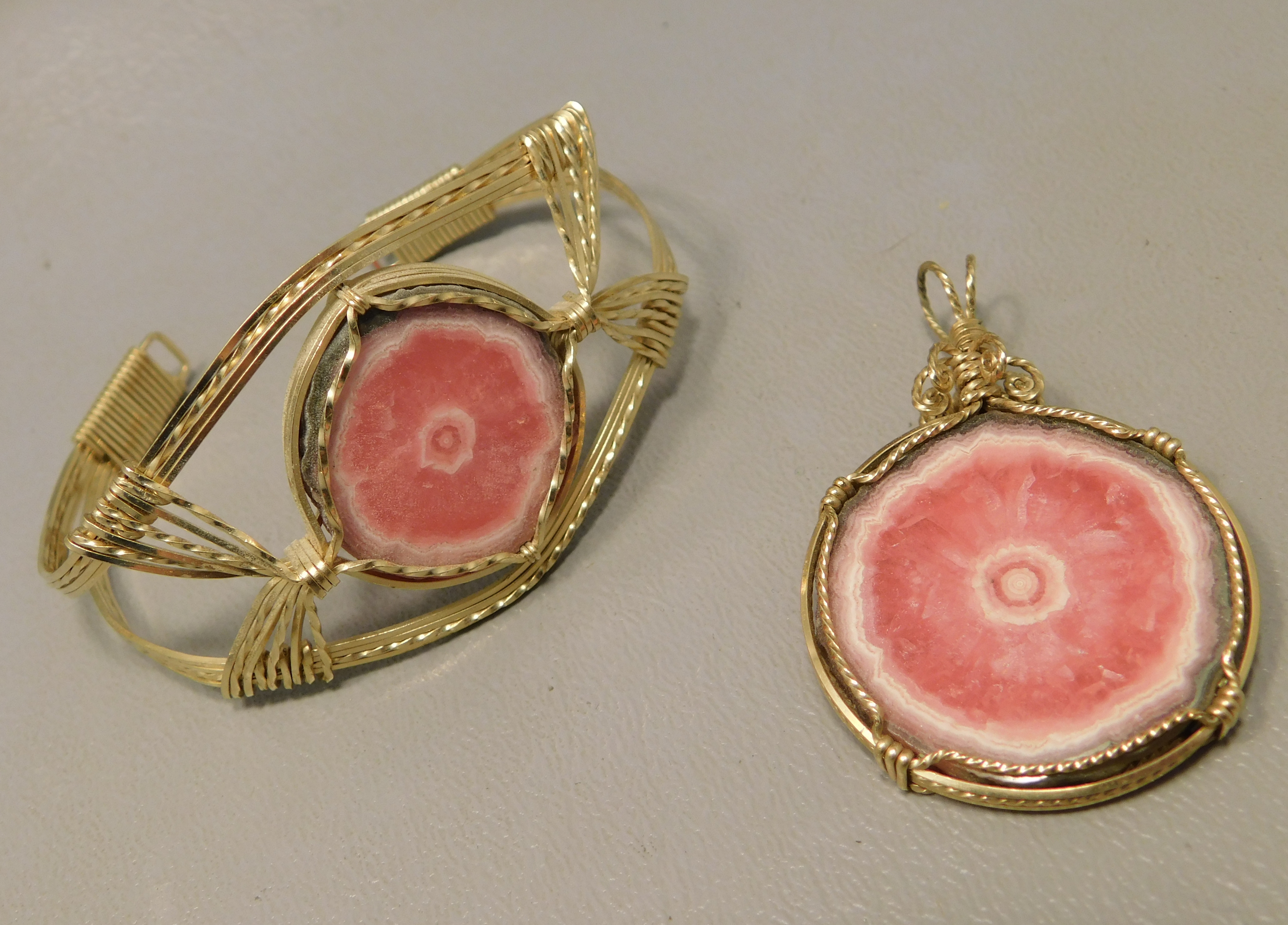 Wire wrapped rhodochrosite cabochons